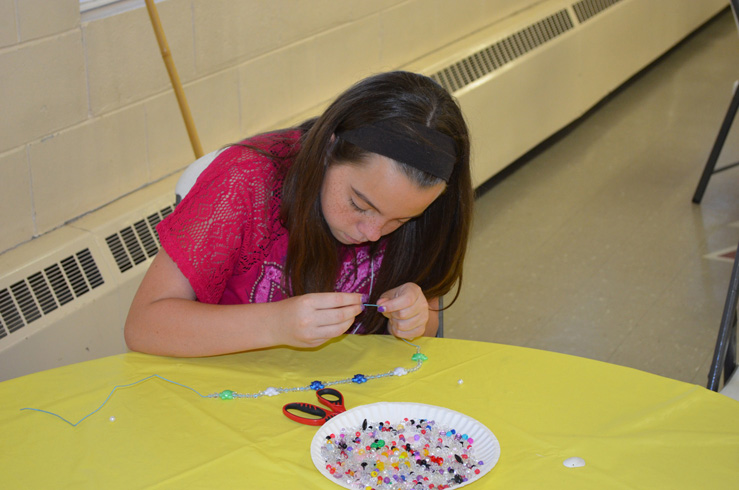 Girl Making Necklace