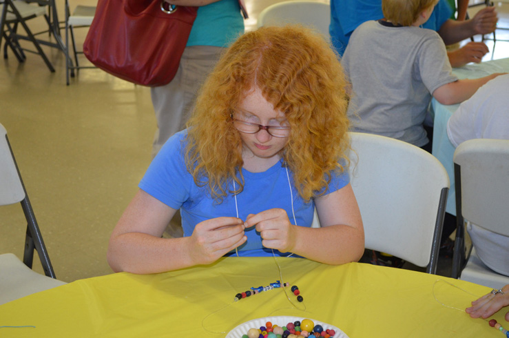 Girl Making Necklace