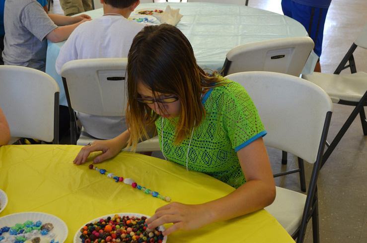 Girl Making Necklace