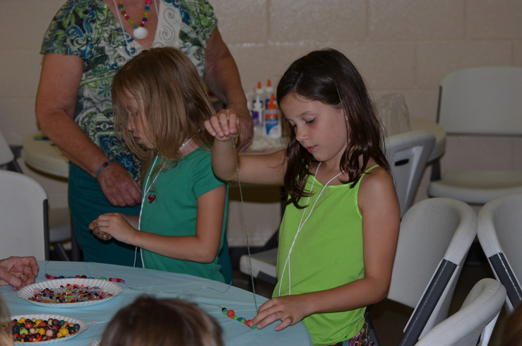 Girls Making Necklaces
