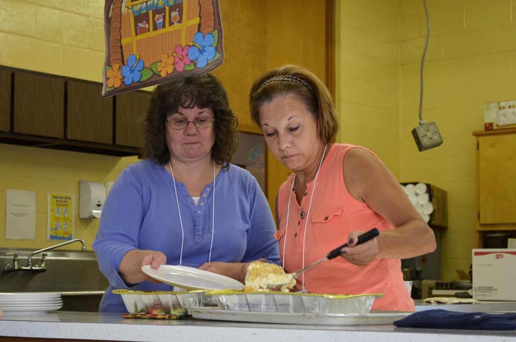 Volunteers Serving Meal
