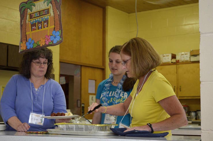 Volunteers Serving Meal