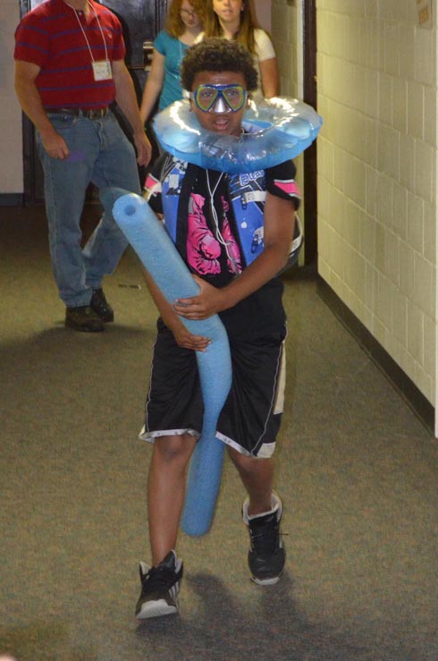 Boy Dressed with Float Ring, Goggles & Life Vest