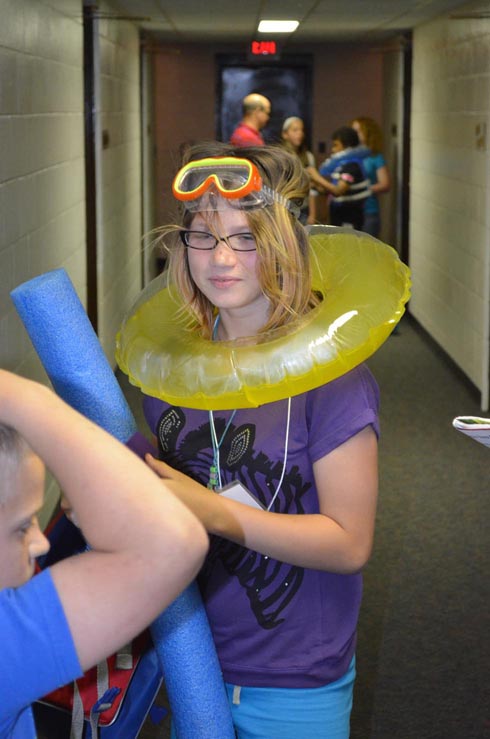 Girl Dressed with Float Ring, Goggles & Life Vest