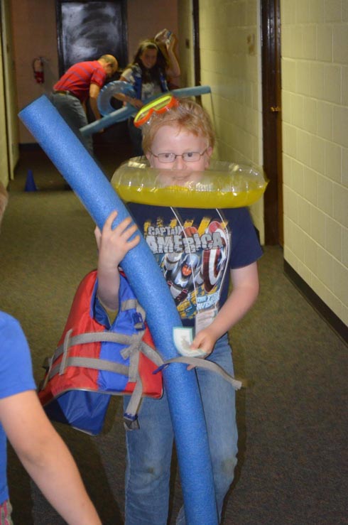 Boy Dressed with Float Ring, Goggles & Life Vest