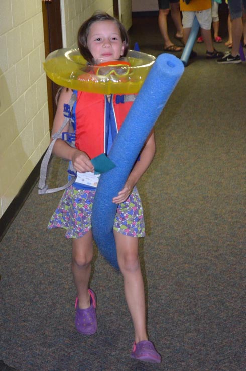 Girl Dressed with Float Ring, Goggles & Life Vest