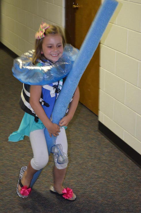 Girl Dressed with Float Ring, Goggles & Life Vest