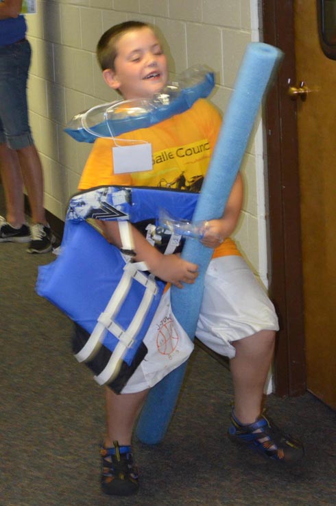 Boy Dressed with Float Ring, Goggles & Life Vest
