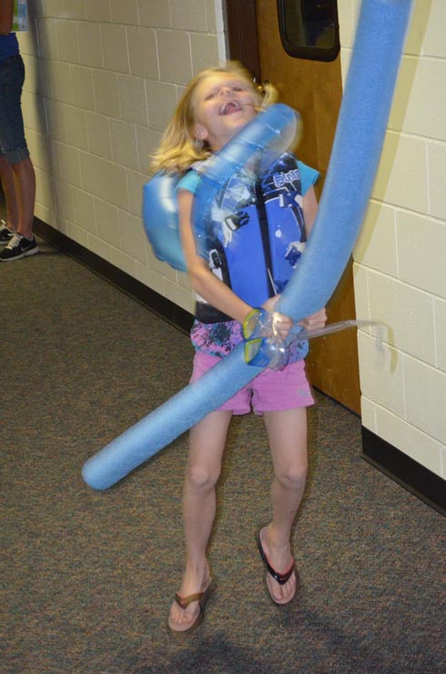 Girl Dressed with Float Ring, Goggles & Life Vest