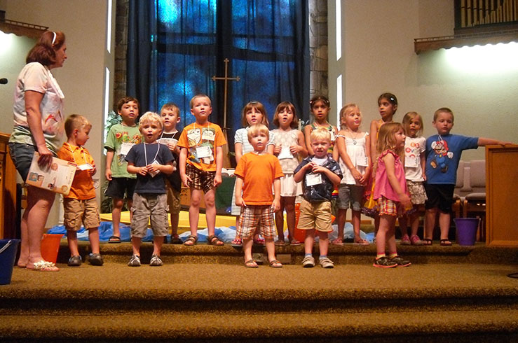 Preschool Teachers Leading the Children in a Song