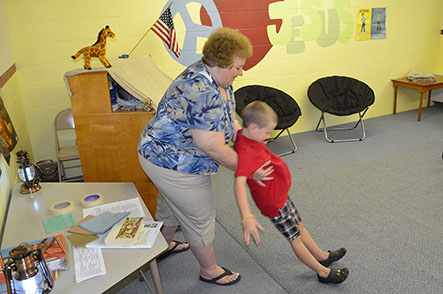 Child Falling Back into LuAnn's Arms