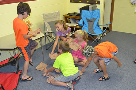 Child Crumpling up Paper