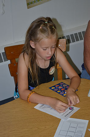 Child Applying Sticker