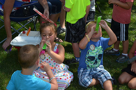 Children Eating Frozen Icicles