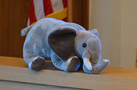 Stuffed Elephant on Railing