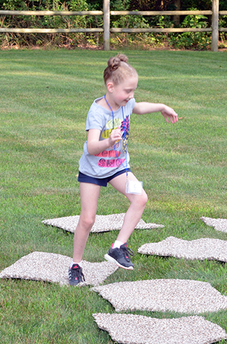 Child Playing 'Hop-Scotch'