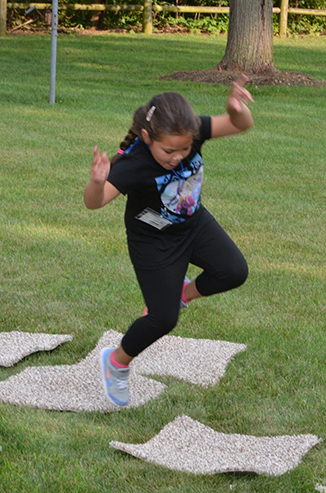 Child Playing 'Hop-Scotch'