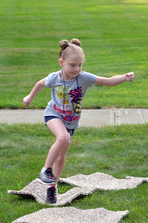 Child Playing 'Hop-Scotch'