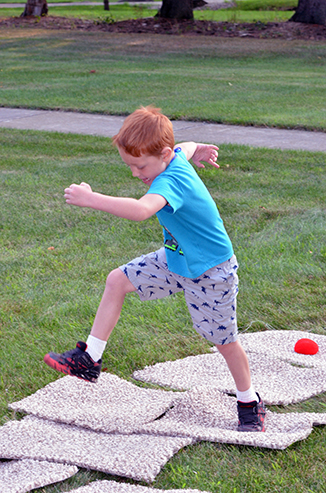 Child Playing 'Hop-Scotch'