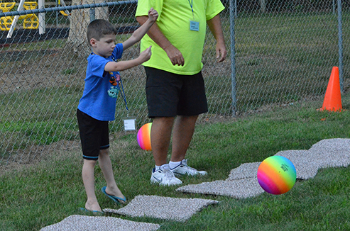 Child Throwing Ball