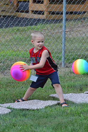 Child Throwing Ball