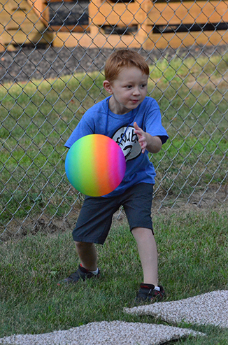 Child Throwing Ball