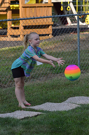 Child Throwing Ball