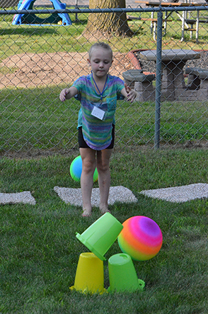 Child Throwing Ball