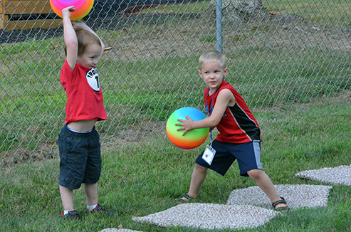 Child Throwing Ball