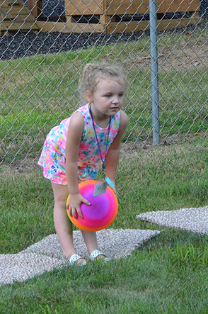 Child Throwing Ball