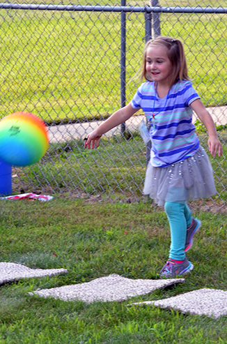 Child Throwing Ball