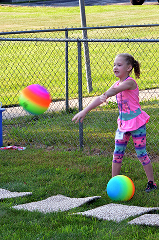 Child Throwing Ball