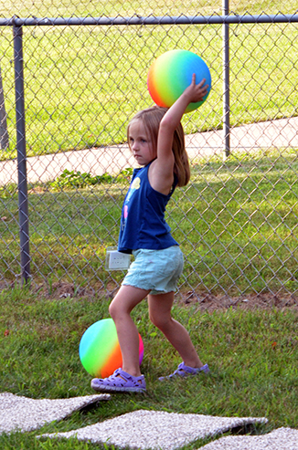 Child Throwing Ball