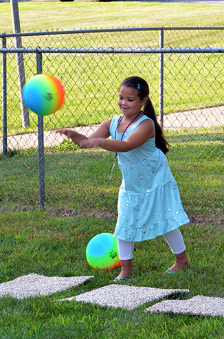 Child Throwing Ball