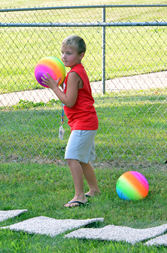 Child Throwing Ball