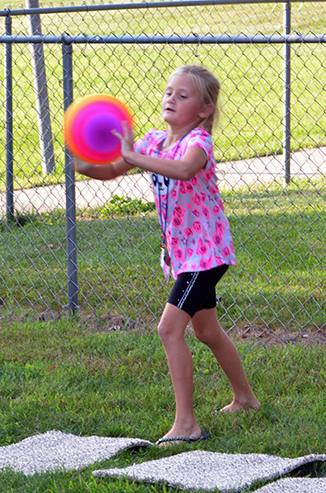 Child Throwing Ball