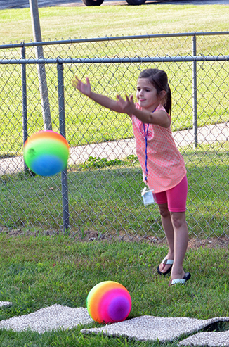 Child Throwing Ball