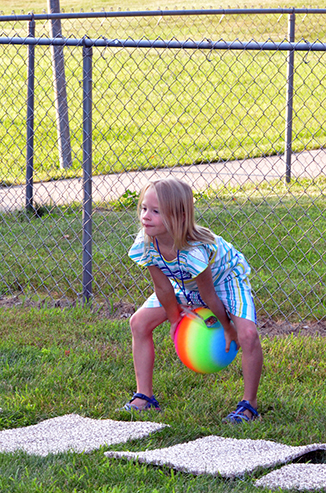 Child Throwing Ball