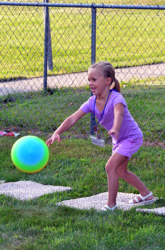 Child Throwing Ball