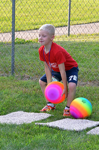 Child Throwing Ball