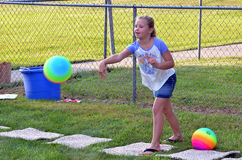 Child Throwing Ball