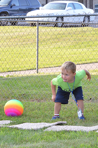 Child Throwing Ball