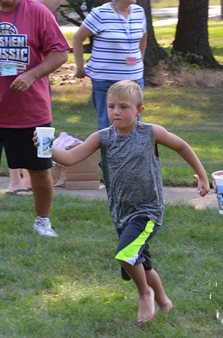 Child Running with Glass of Water