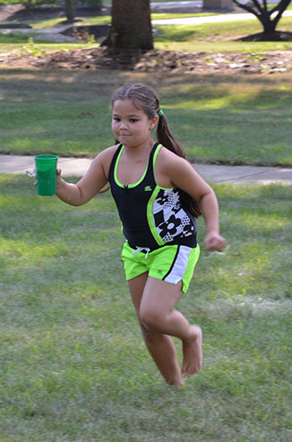 Child Running with Glass of Water