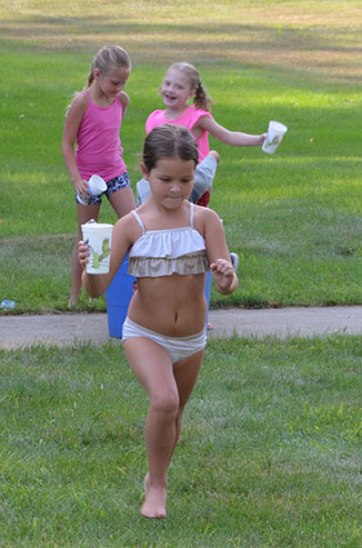 Child Running with Glass of Water