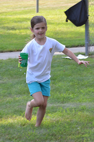 Child Running with Glass of Water