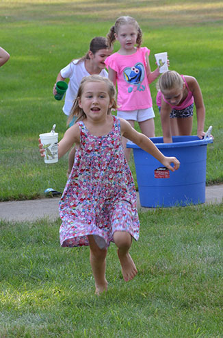 Child Running with Glass of Water