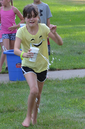 Child Running with Glass of Water