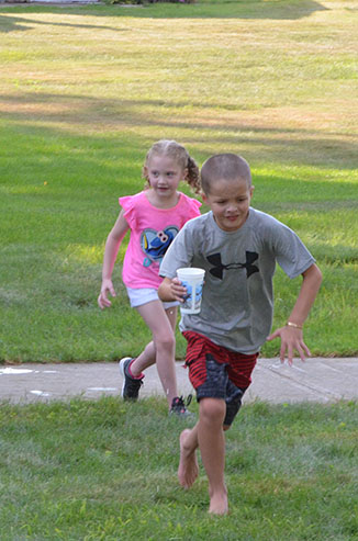 Child Running with Glass of Water