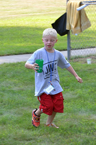 Child Running with Glass of Water